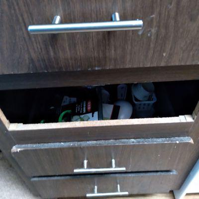 Missing drawer cabinet crumbling