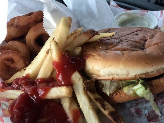 Cheeseburger with grilled onions, fries and extra order of onion rings.