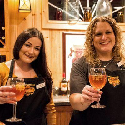 Our wonderful tasting room attendants Lindsey & Alex serving this fall's delicious Apple Sangria.