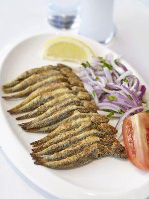 Our seasonal specialty: pan-fried anchovies. A Mediterranean delicacy.