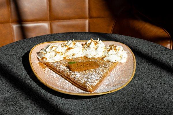 A delightful combination of rose hip jam, Biscoff butter spread, Biscoff cookie crumbles, powdered sugar, and whipped cream.