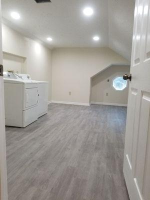 Transformed our client's attic into a fully functional laundry room/office.