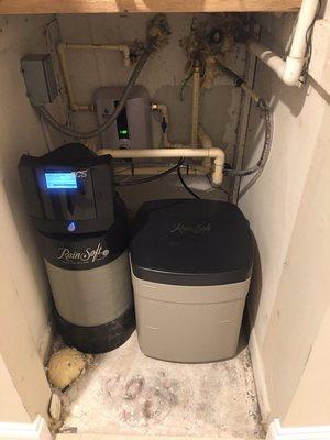 Custom install in a condo of a tankless water heater with a Rainsoft full house water conditioner system