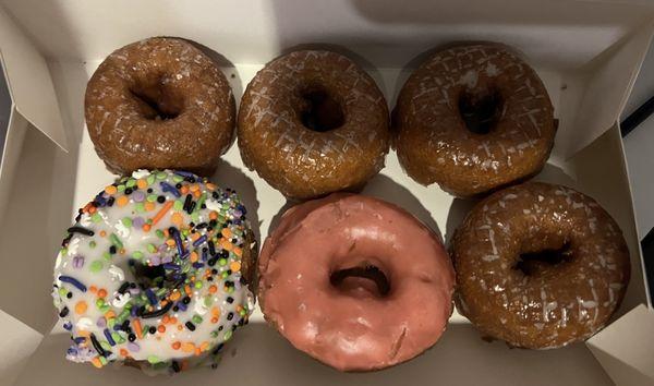 Brown cake white sprinkle, pumpkin donut, and Brown cake pink frosted