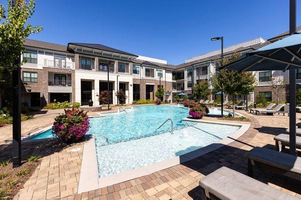 Second resort-style swimming pool with surrounding sundeck