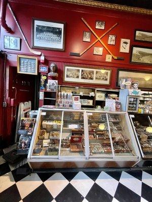 The Beautiful interior of the shop with rich barnyard rustic red walls, dark woods & black & white checkerboard floor @ Leavitt & Peirce