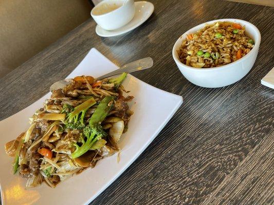 Chop suey with fried rice.  Hot and sour soup bowl in rear.