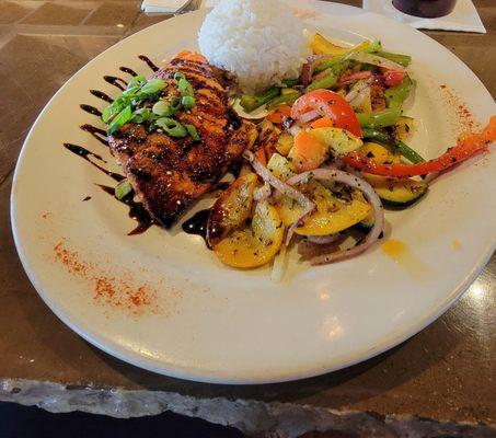 Teriyaki salmon with rice and veggie medley.