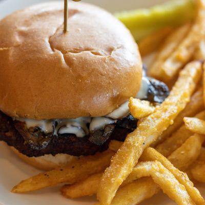 Vegetarian Black Bean Burger with grilled mushrooms and provolone cheese.