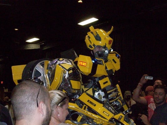 insane Transformer costumed attendee towers above everyone