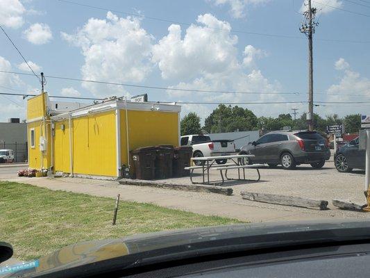 Back side of the restaurant. About 7th car back.