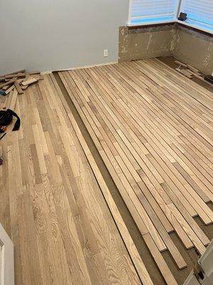 Installing White Oak Hardwood.