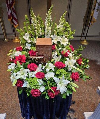 Flowers surrounding the urn.