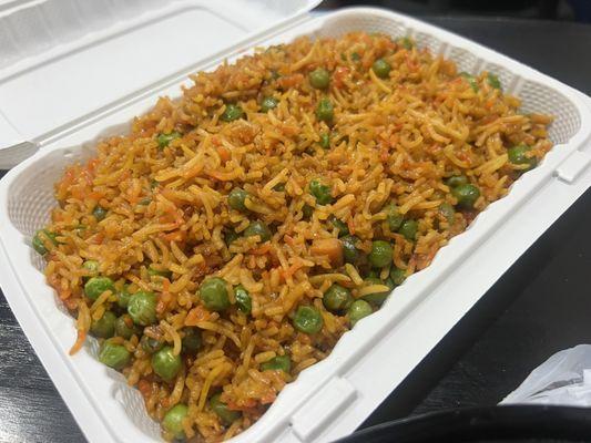 Malian fried rice = Peas, Carrots, Soy sauce mix with white Jasmine rice.