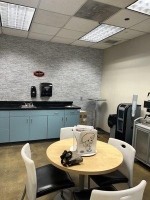 Comfortable waiting area with coffee/tea/water available