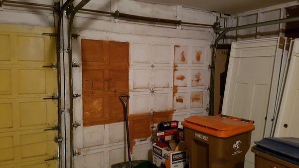 Before Picture - Old wooden garage door.