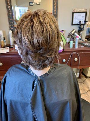 Sassy shorter layered cut with this beautiful brown color