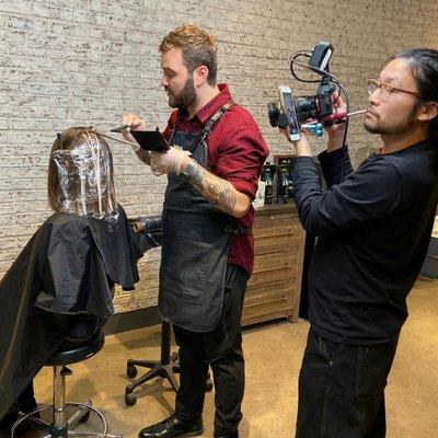 The Keep (salon) owner/ international balayage artist Sebastian Langman-Kirtley being filmed for L'Oreal Professional