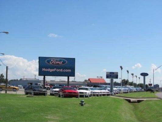 HodgeFord.com sign in front of New Cars.