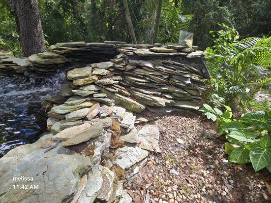 Side wall from water all the way around.  There foam stopped holding rocks sideways