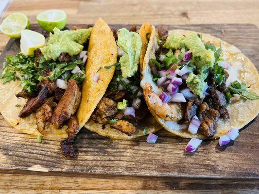 Delicious adobada & surf & turf tacos at Los Cuates Seafood & Bar in Chula Vista, CA. The presentation could be better.