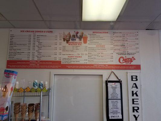 The menu board behind the cash register.