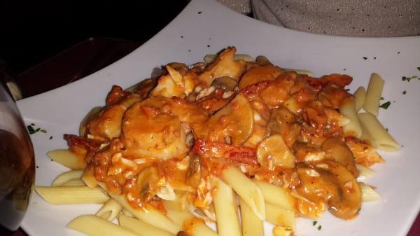 Seafood Trio.. shrimp.scallops.crab meat. Light sauce over penne..yummy!