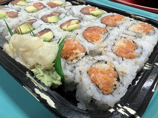 Avocado salmon roll and spicy salmon roll as part of a three roll lunch special takeout.