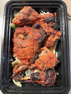 Dry tandoori chicken. Looks like cooked too much.