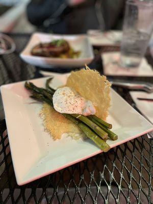 Grilled asparagus with poached egg, cured yolk, and frico