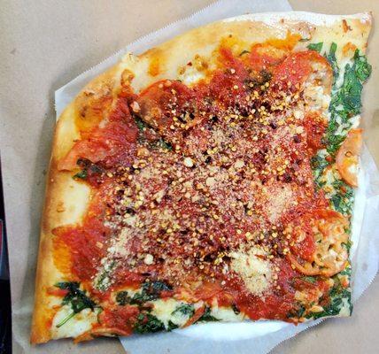 Spinach, Garlic, & Tomato slice, which I had them add some tomato sauce, then I added some hot peppers & cheese.