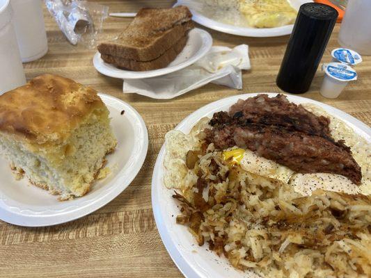 Biscuit, eggs, hash, hash browns.