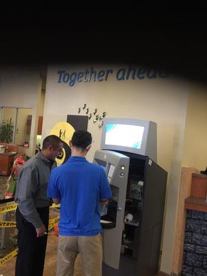 Daily maintenance at the coin machine in the credit union. Come by and cash your coins! Friendly staff and great service!