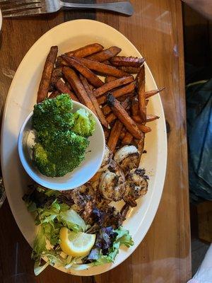 Grilled Shrimp with sides of Sweet Potato Fries and Steamed Broccoli Hubby thought shrimp were too done but tasty