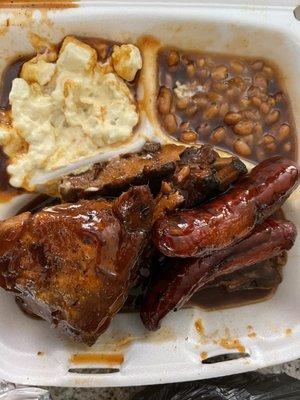 Potato salad, baked beans, chicken, brisket, hot link