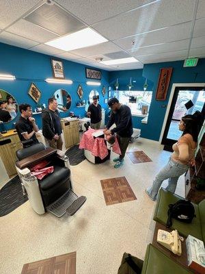 Shaving training for the Barbers. Continuing education is a big part of our culture.