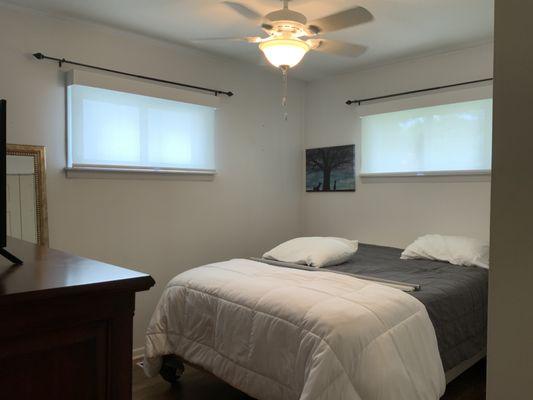 Hunter Douglas Designer Screen Shades on Two Small Windows in a Bedroom