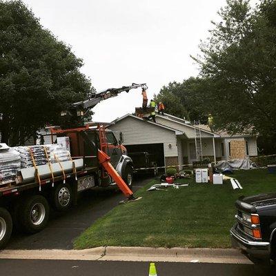 The correct way to load a roof with new shingles.