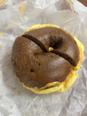 Pumpernickel bagel with egg and cheddar