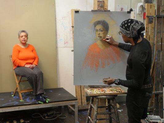 Instructor demonstrates a pastel painting.