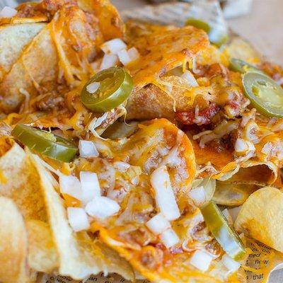 If you want to try the chips but need a little something extra, look no further. Our house-made chips topped with chili, jalapenos, onions,