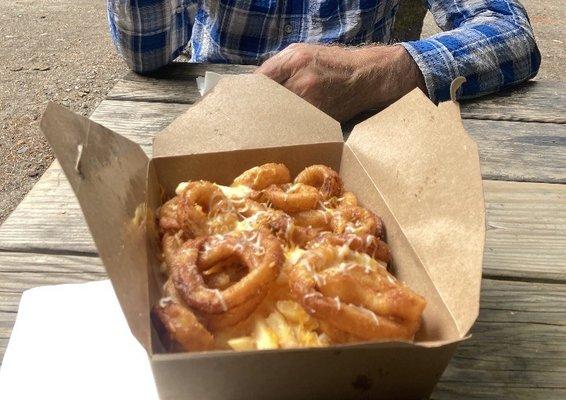 Fries and onion rings on motorcycle rio