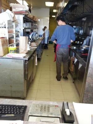 The kitchen staff preparing your meal