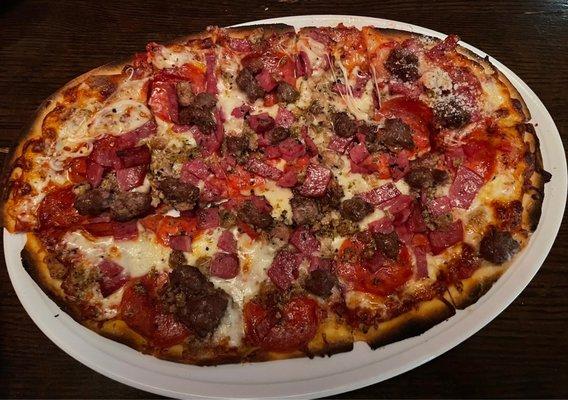 Small meat combo pizza hold the Canadian bacon.