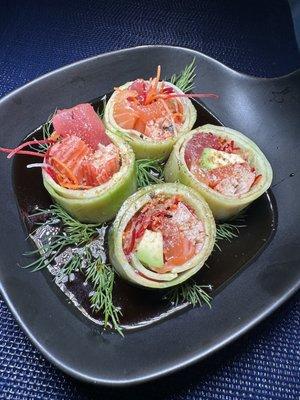 Tuna, salmon, Kani avocado wrapped in cucumber in a ponzu sauce