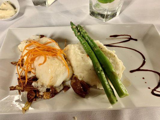 Chilean Nola Sea Bass on roasted artichoke hearts with asparagus and delicious mashed potatoes. Melts in your mouth.