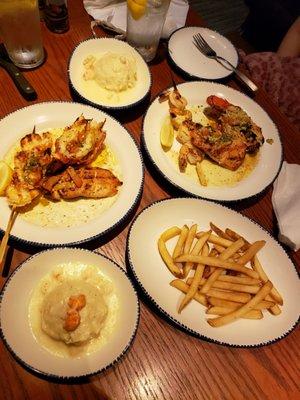 Two for tuesday: each has a lobster, shrimp, and salmon with 2 sides