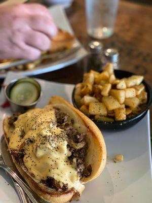 Philly Cheese Steak with cheese sauce and provolone