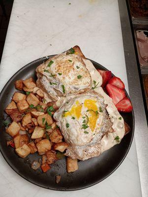 Breakfast potatoes fresh fruit ciabatta bread smothered country sausage gravy and choice of eggs