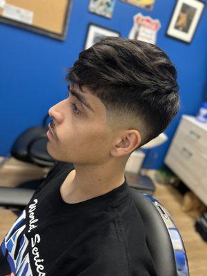 Natural textured style with a Medium Drop Fade